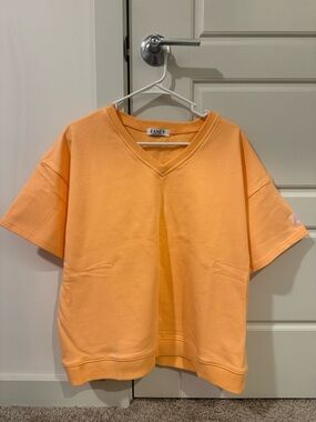 FancyDBoutique Short Sleeve V-Neck Tee in Peach